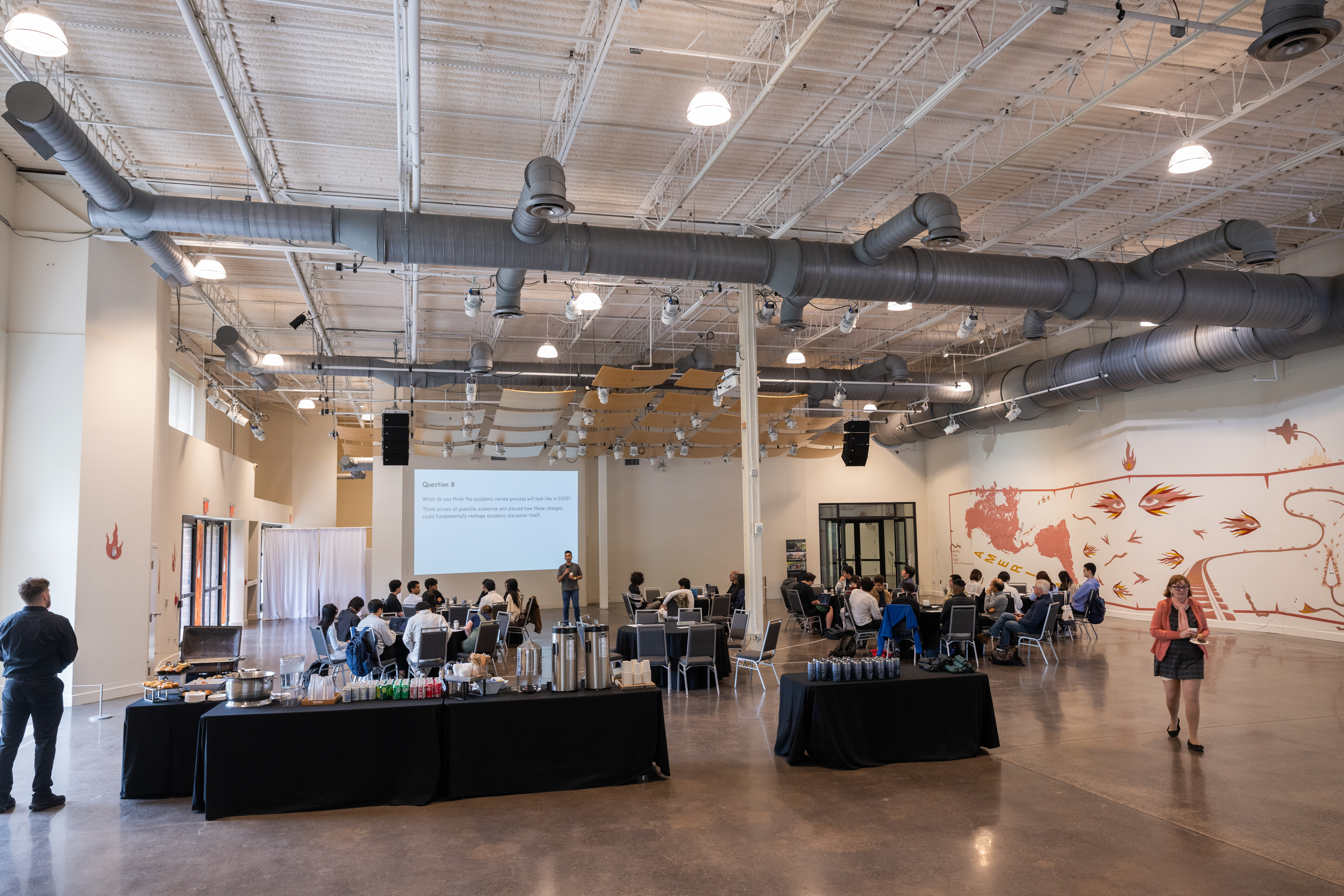 a group of people sitting in a large room