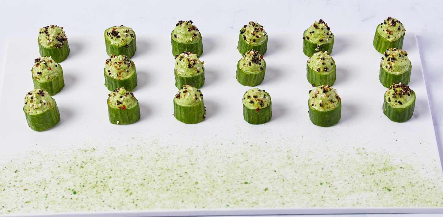 a group of cucumbers on a white surface