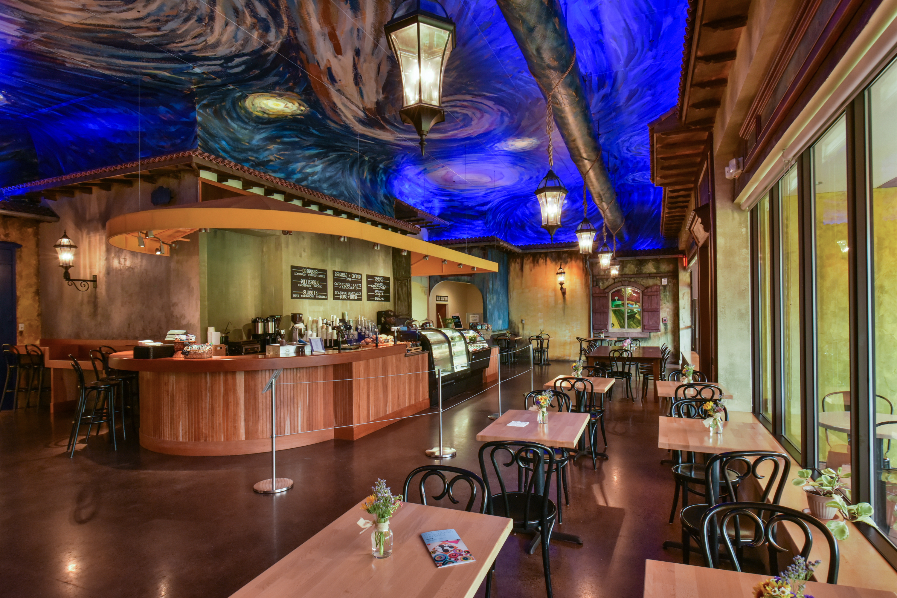 a restaurant with tables and chairs