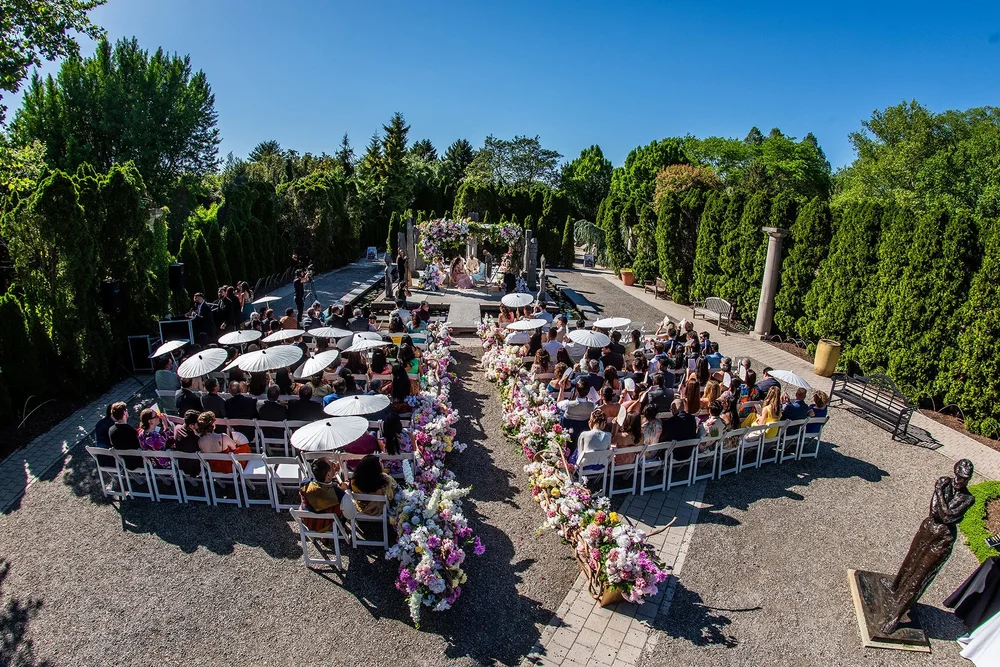 a group of people sitting in chairs outside