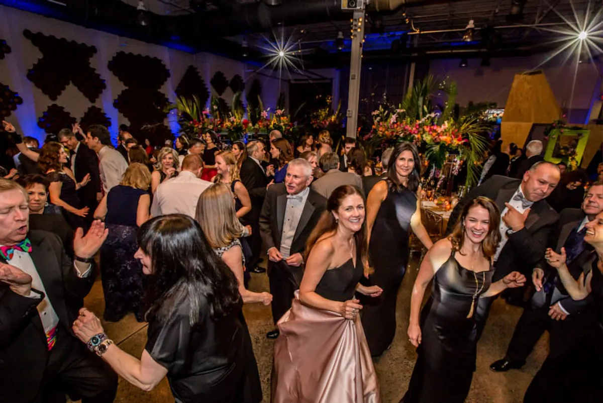 a group of people dancing in a room