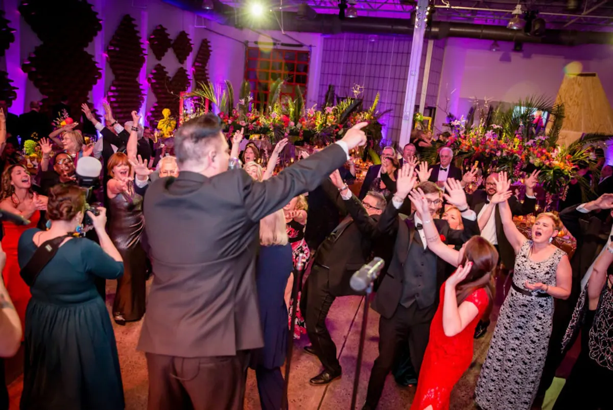 a group of people dancing in a room