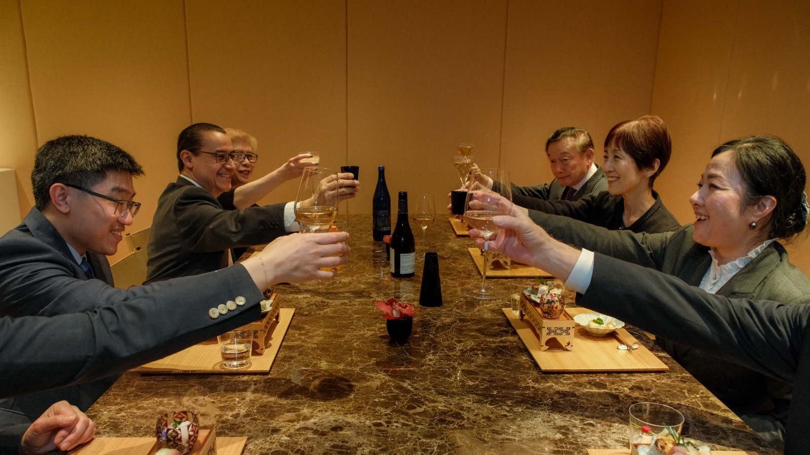 a group of people sitting at a table