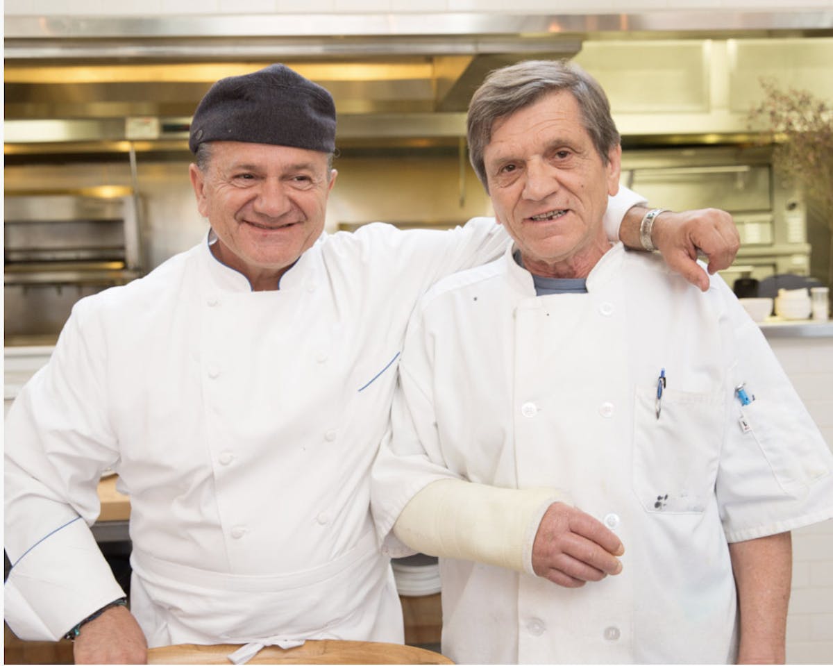 a couple of men posing for a picture