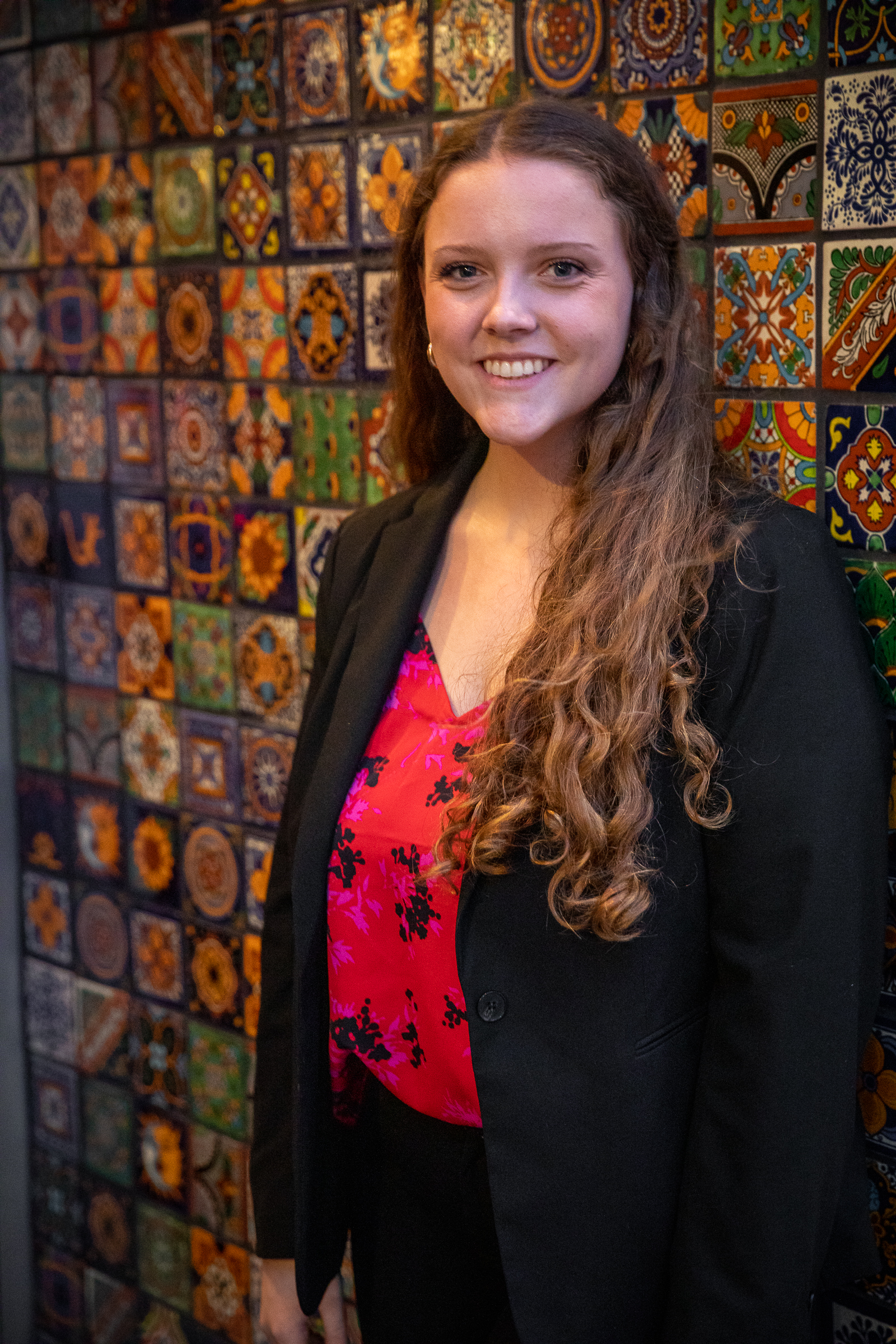 a woman standing in front of a store