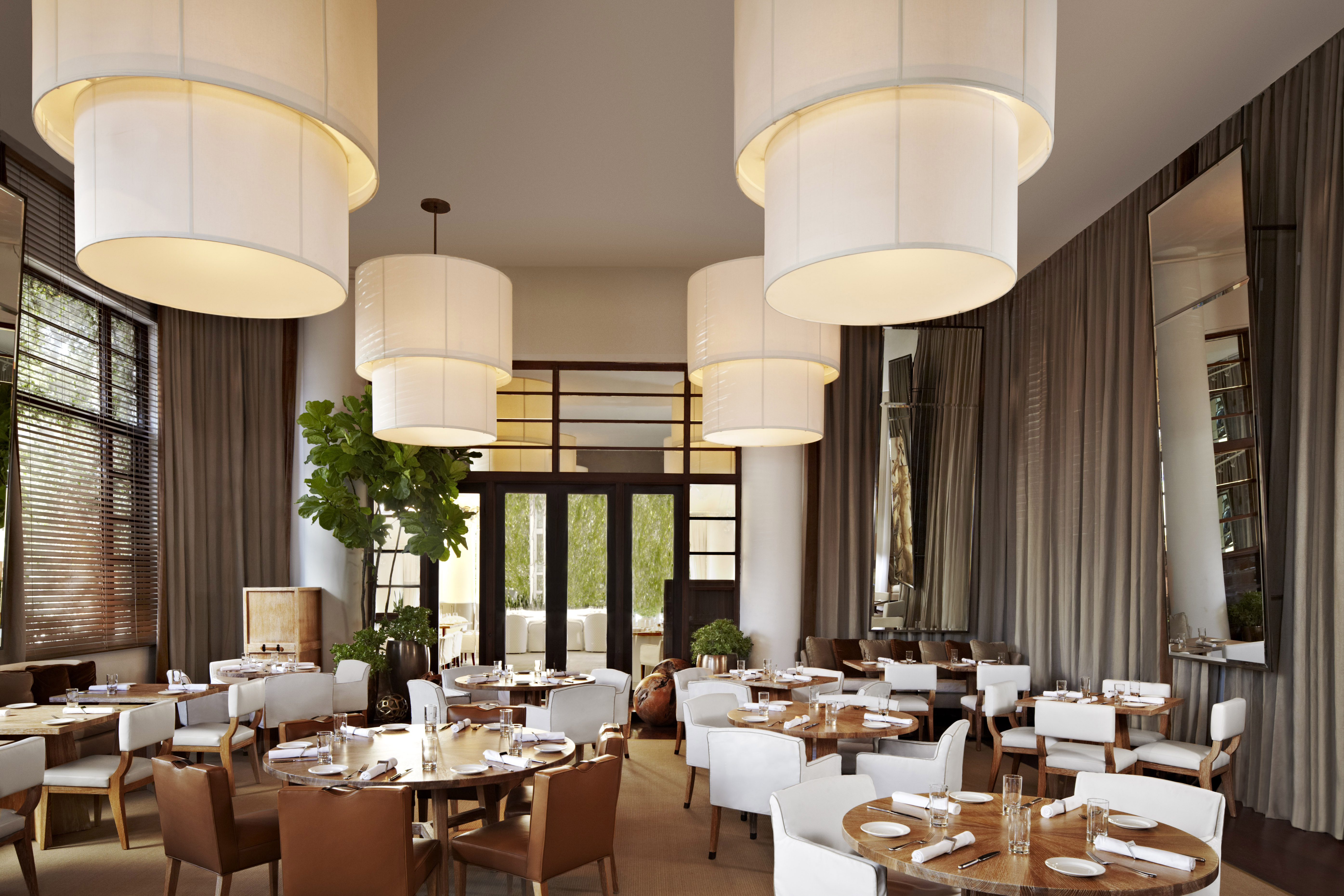 a room filled with furniture and vase on a table