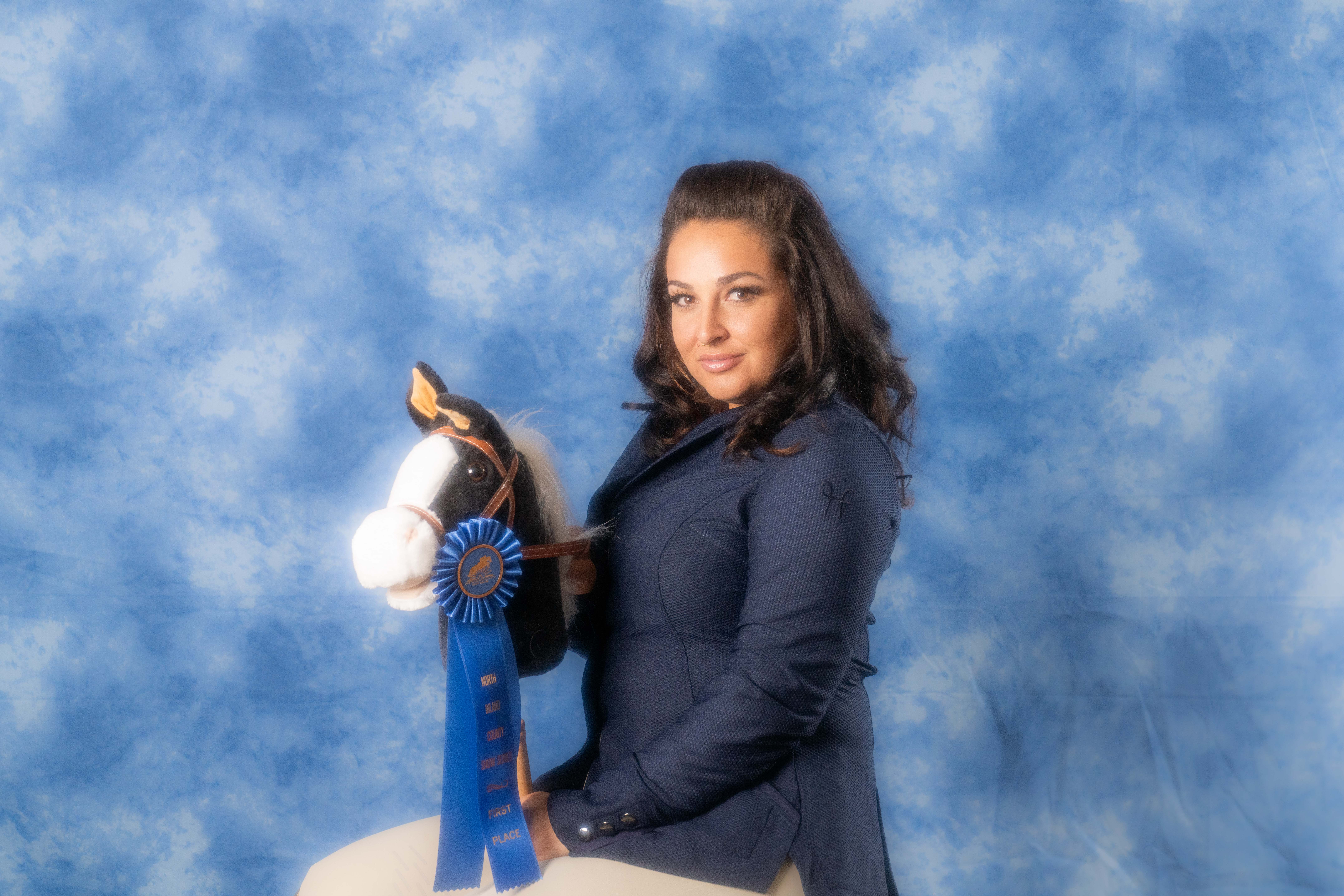 a woman standing in front of a blue sky