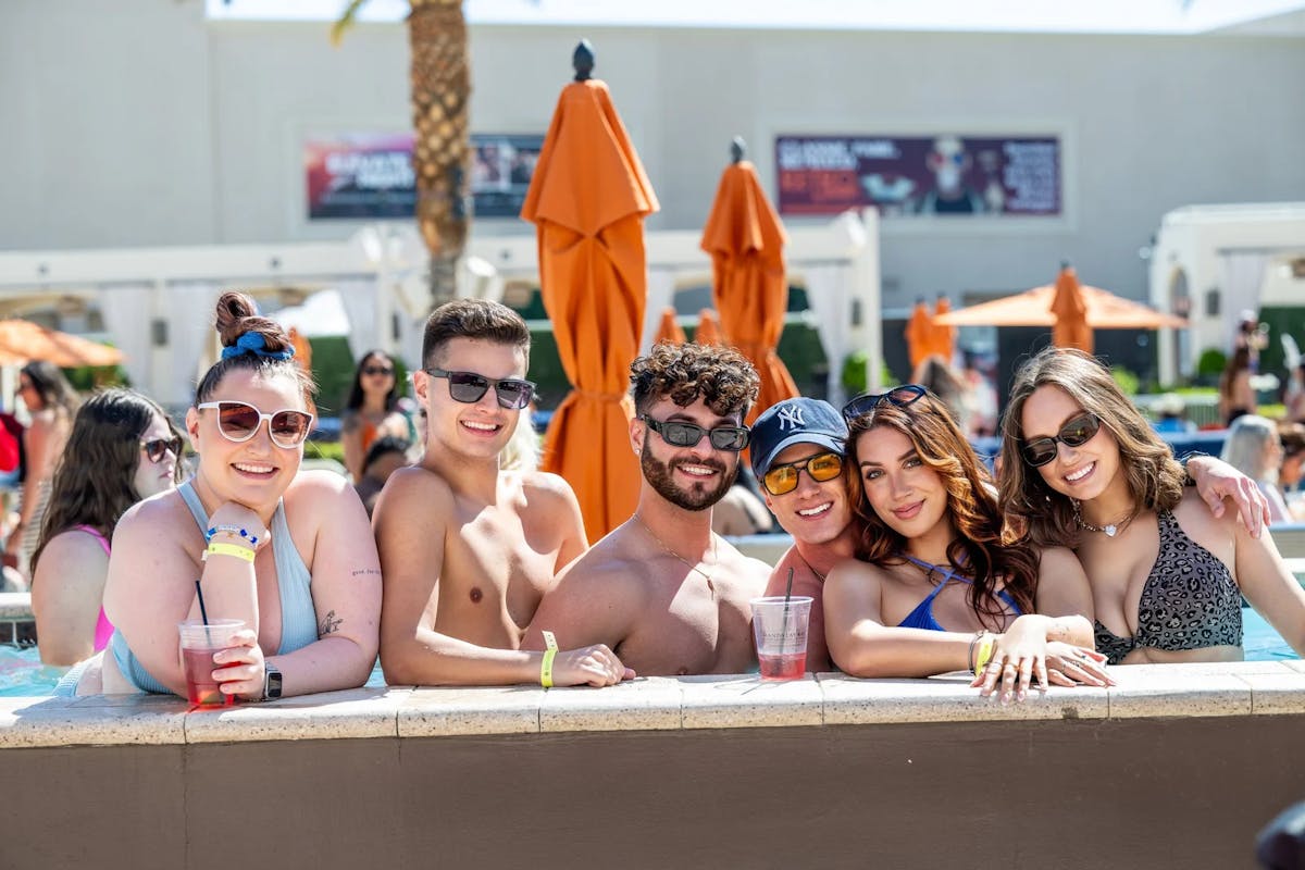 a group of people sitting at a beach