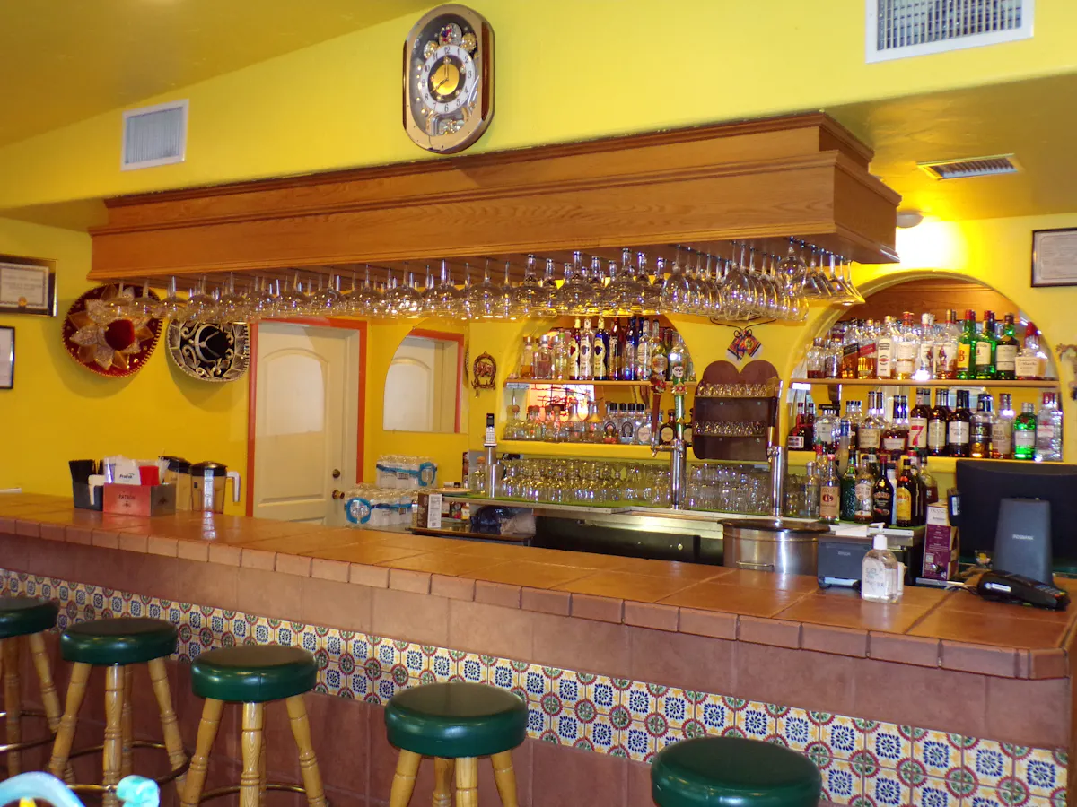 a kitchen with a table in a restaurant
