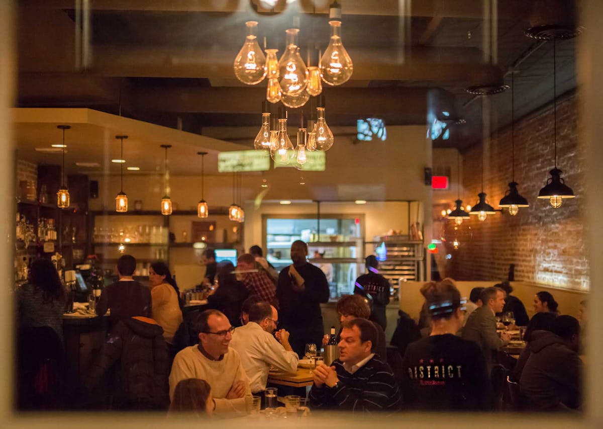 a group of people in a bar