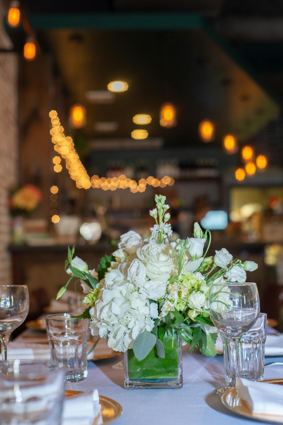 a group of people sitting at a table with wine glasses