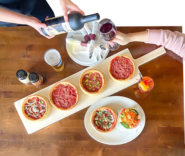 PIZZA FLIGHT! Choose Any 5 6" Deep Dish Style Signature Pizzas and get