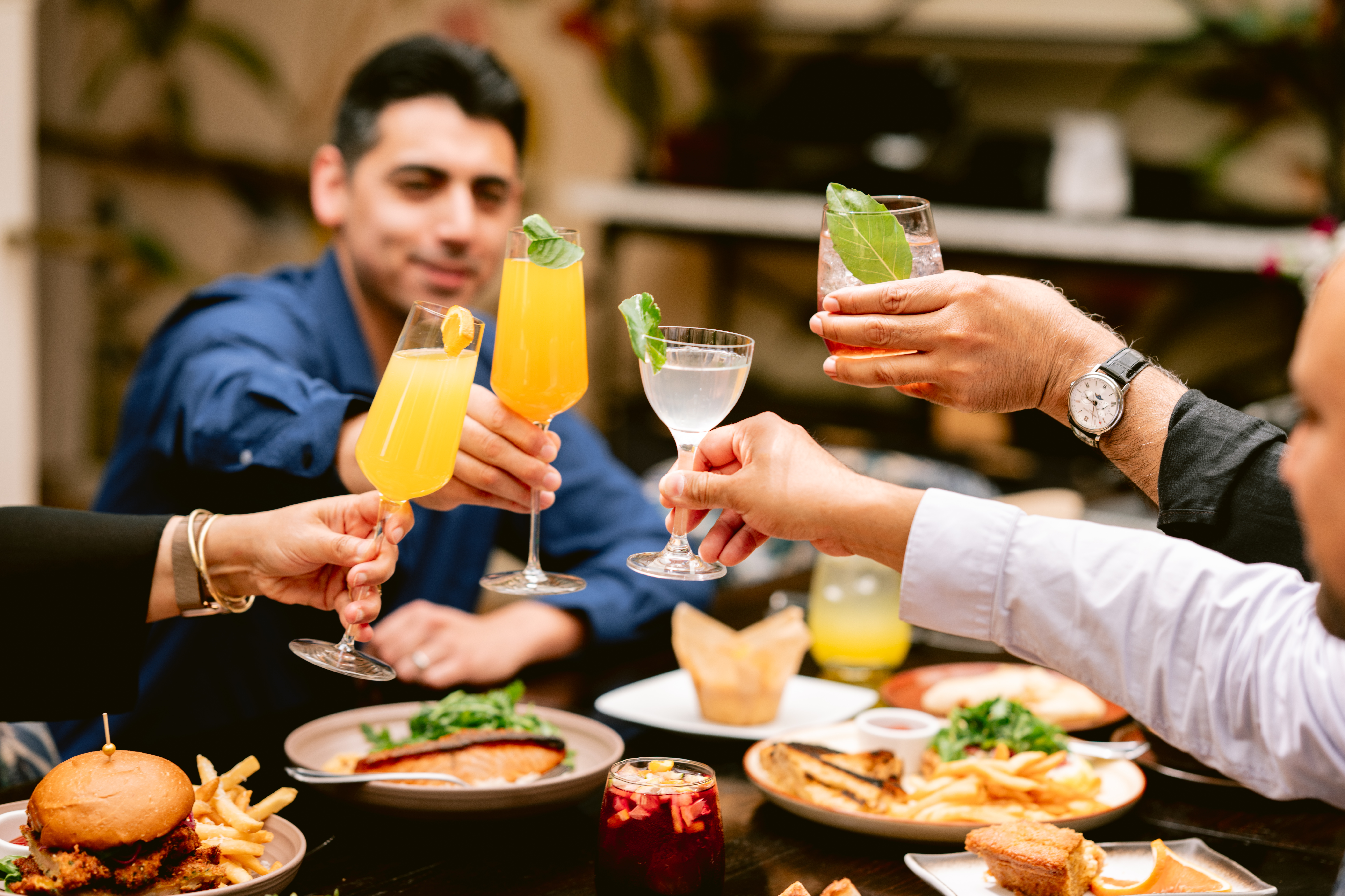 a group of people holding drinks