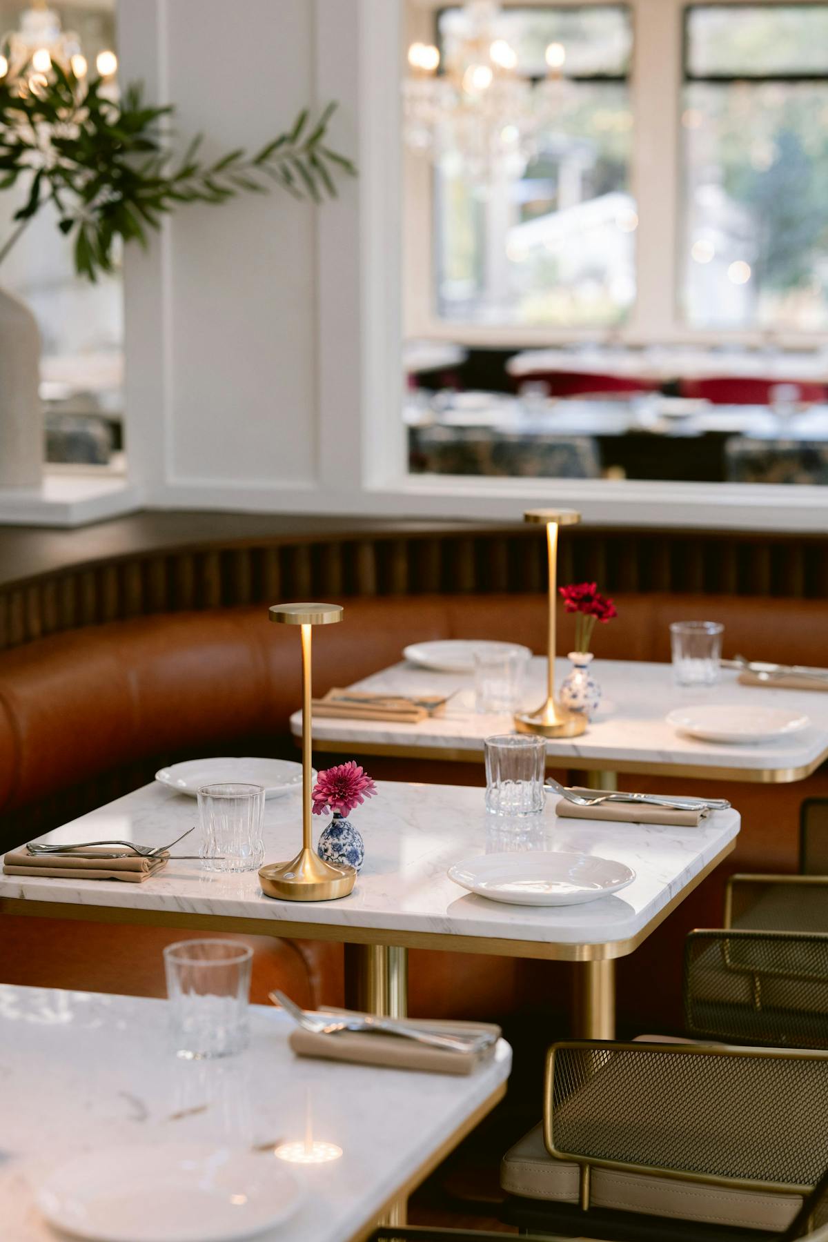 a dining room table in front of a window