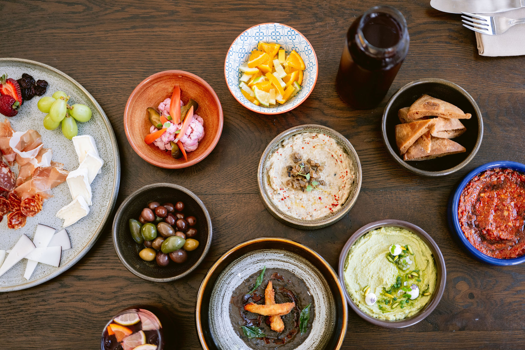 a bowl of food sitting on top of a wooden table