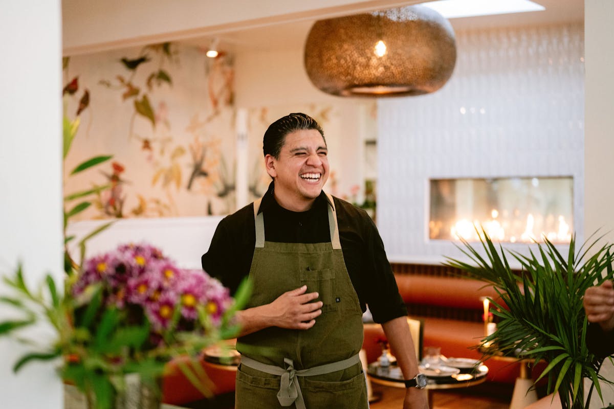 Jonathan Cristaldo standing in front of a flower