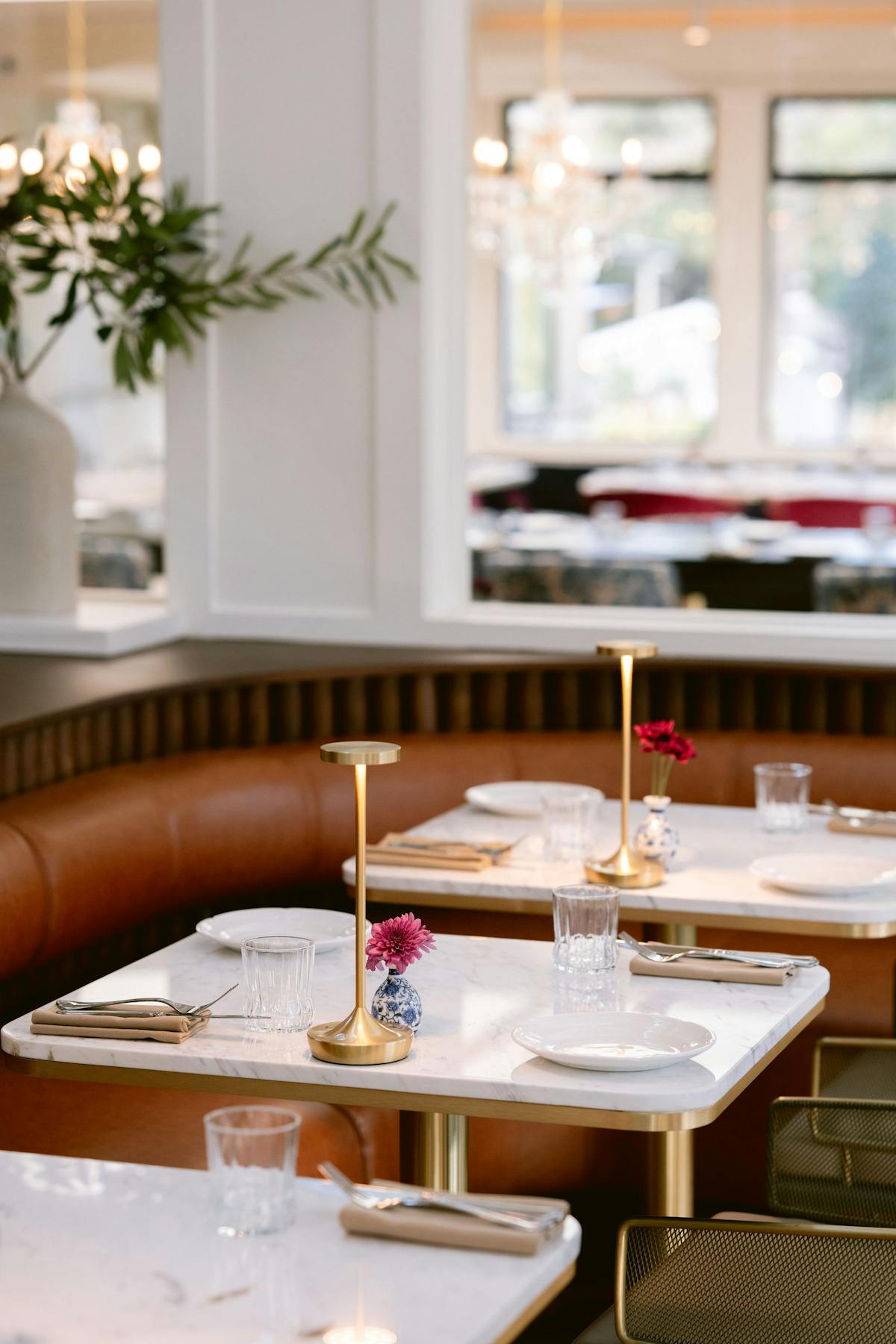 a dining room table in front of a window