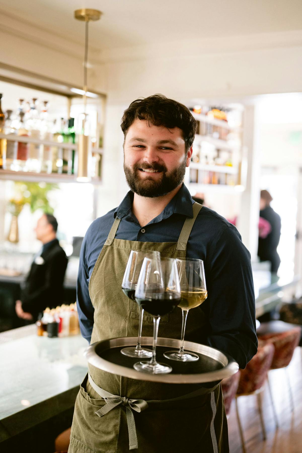 a man holding a glass of wine