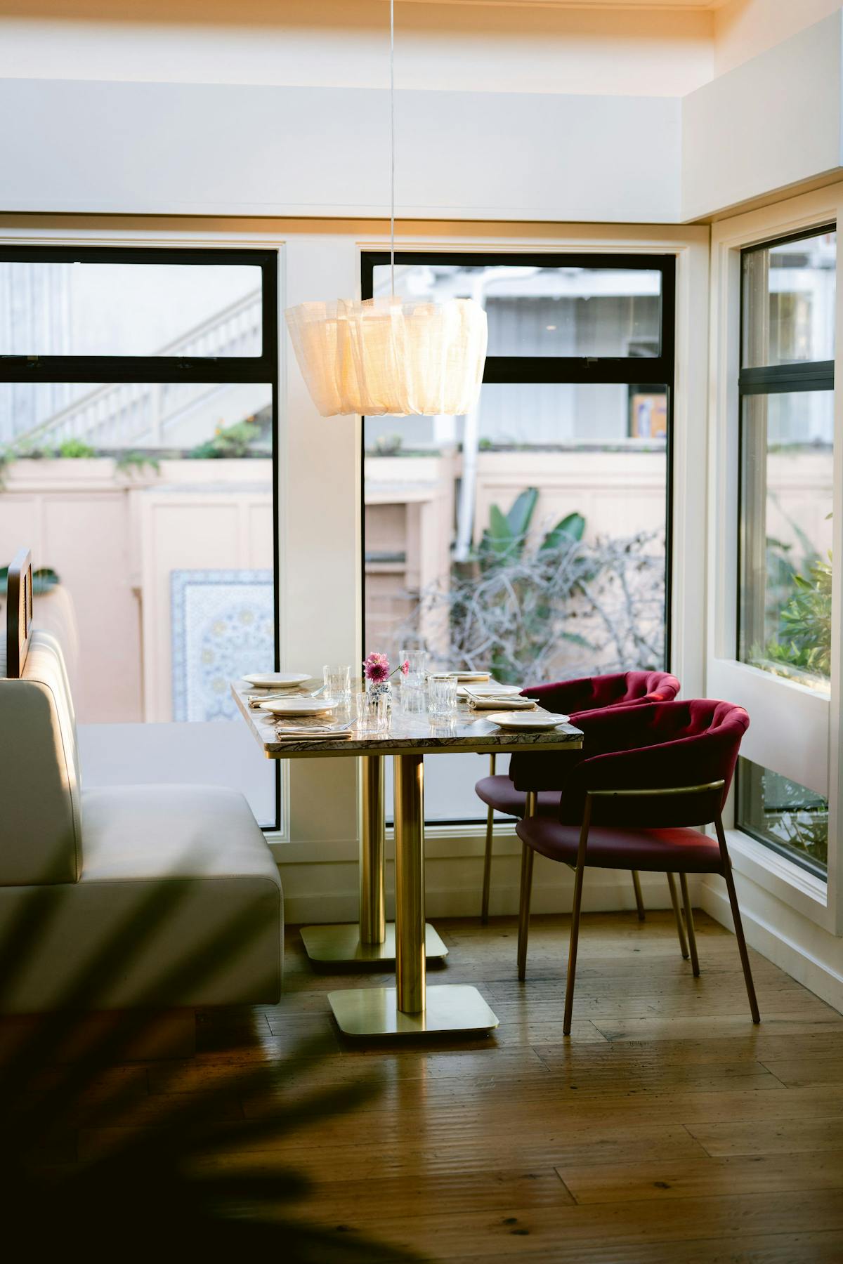 a dining room table in front of a window