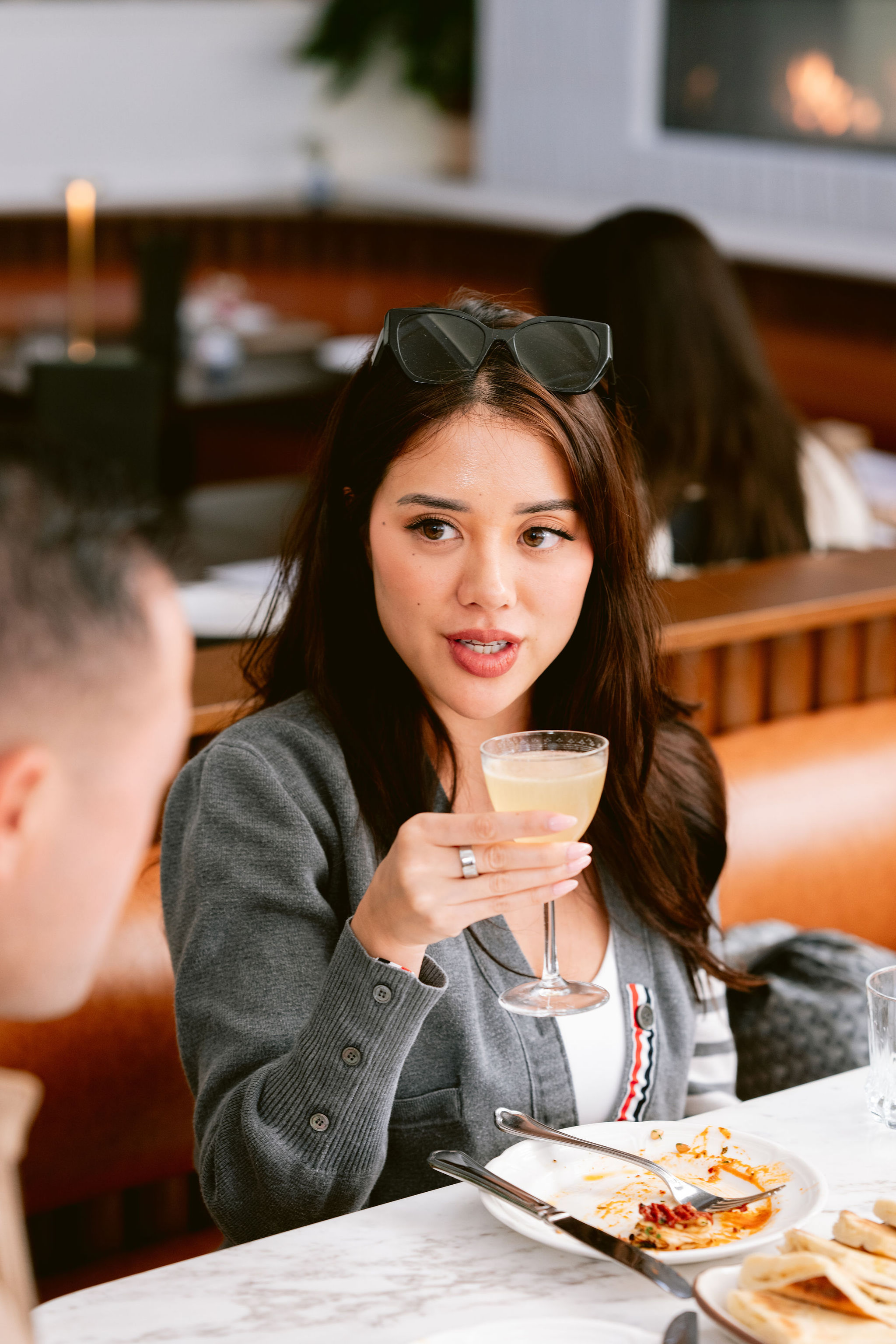 a woman holding a glass of wine