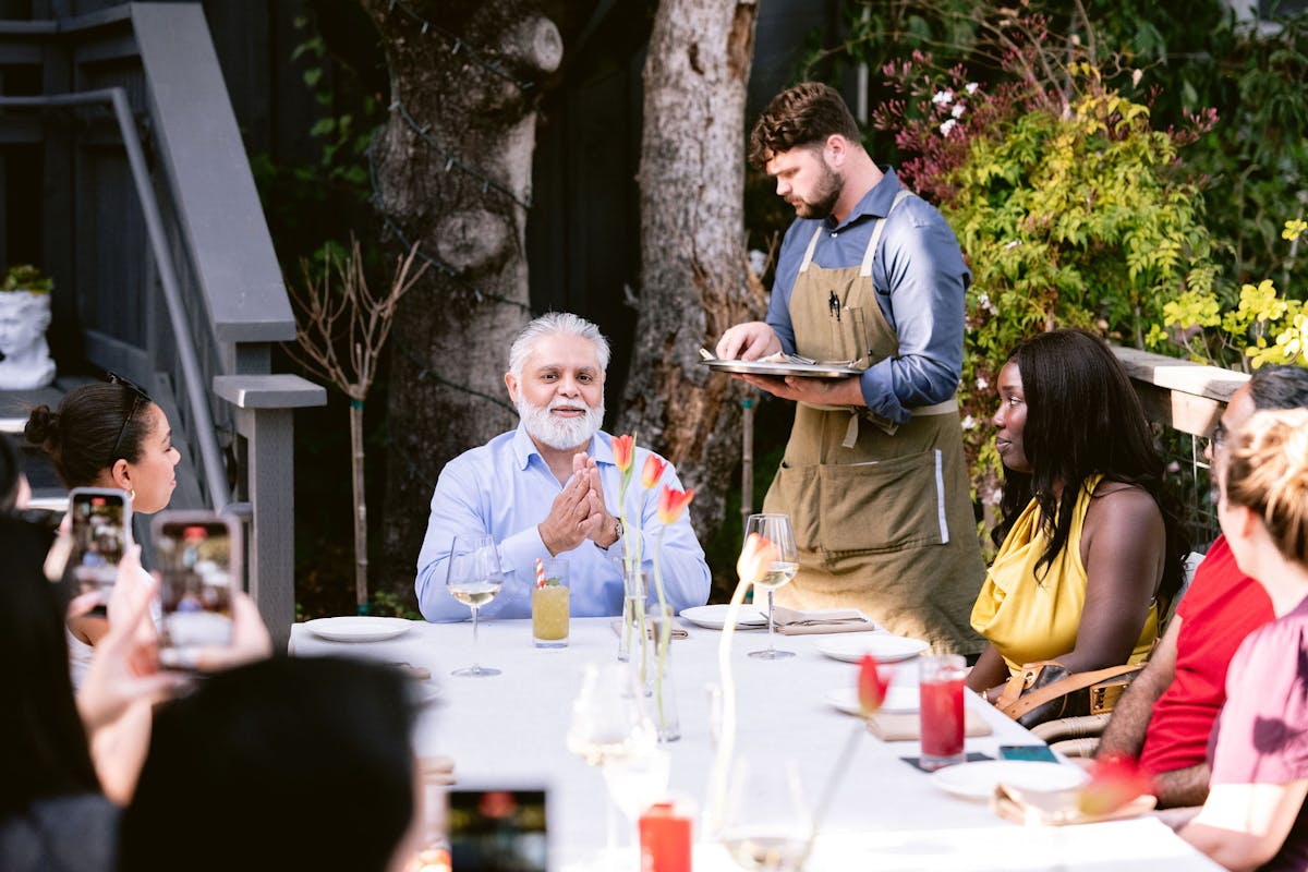 a group of people sitting at a table