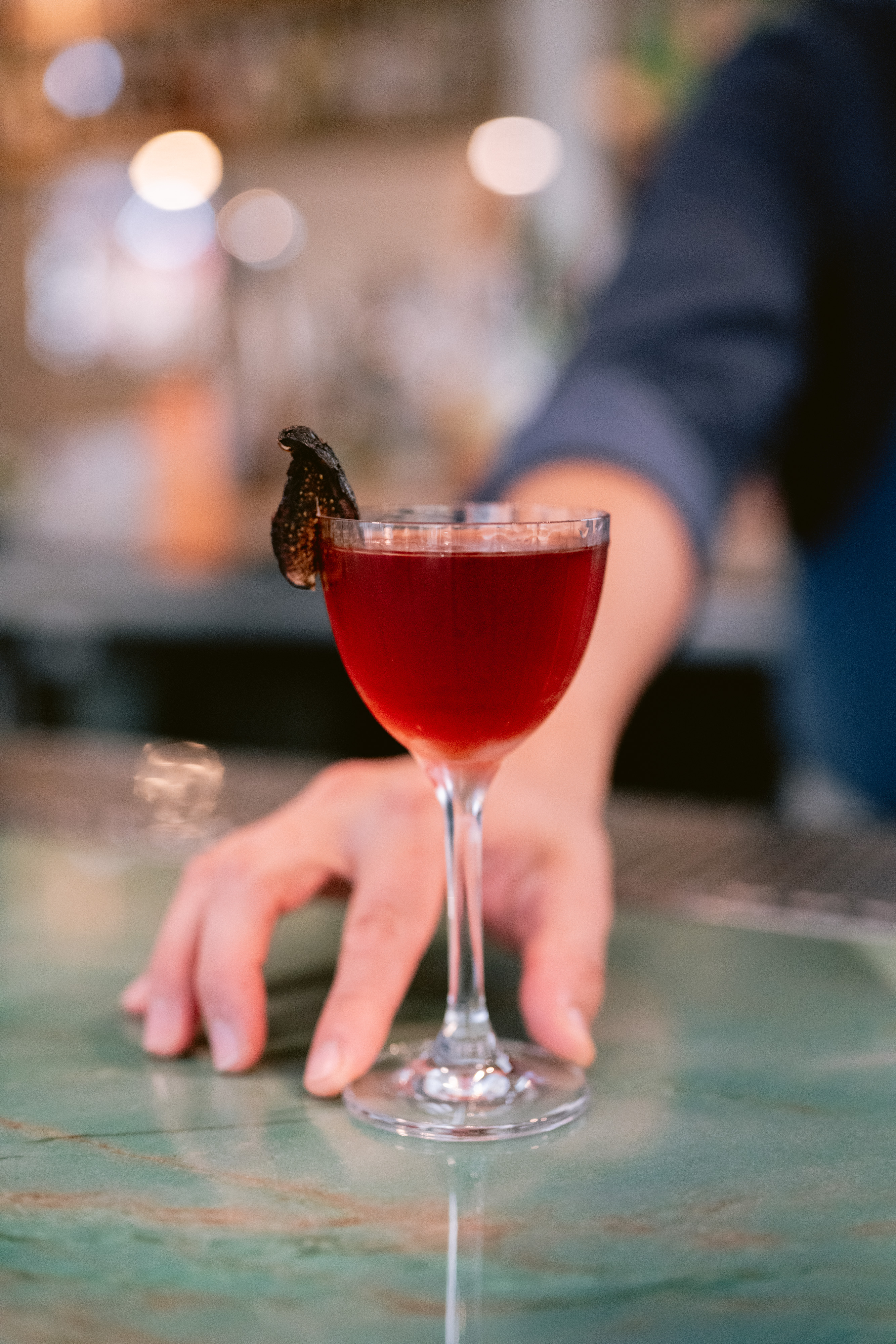 a person holding a wine glass