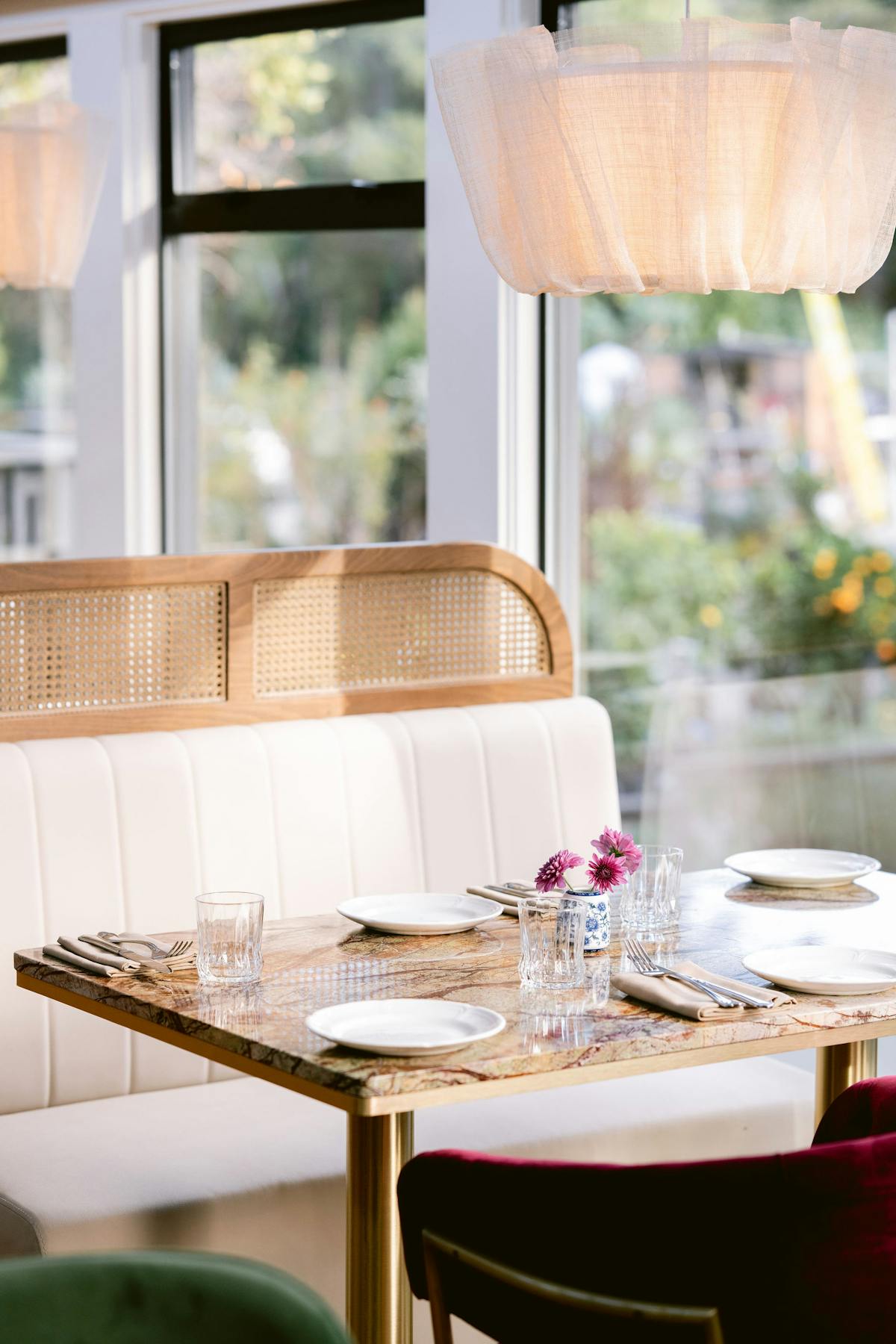 a dining room table in front of a window
