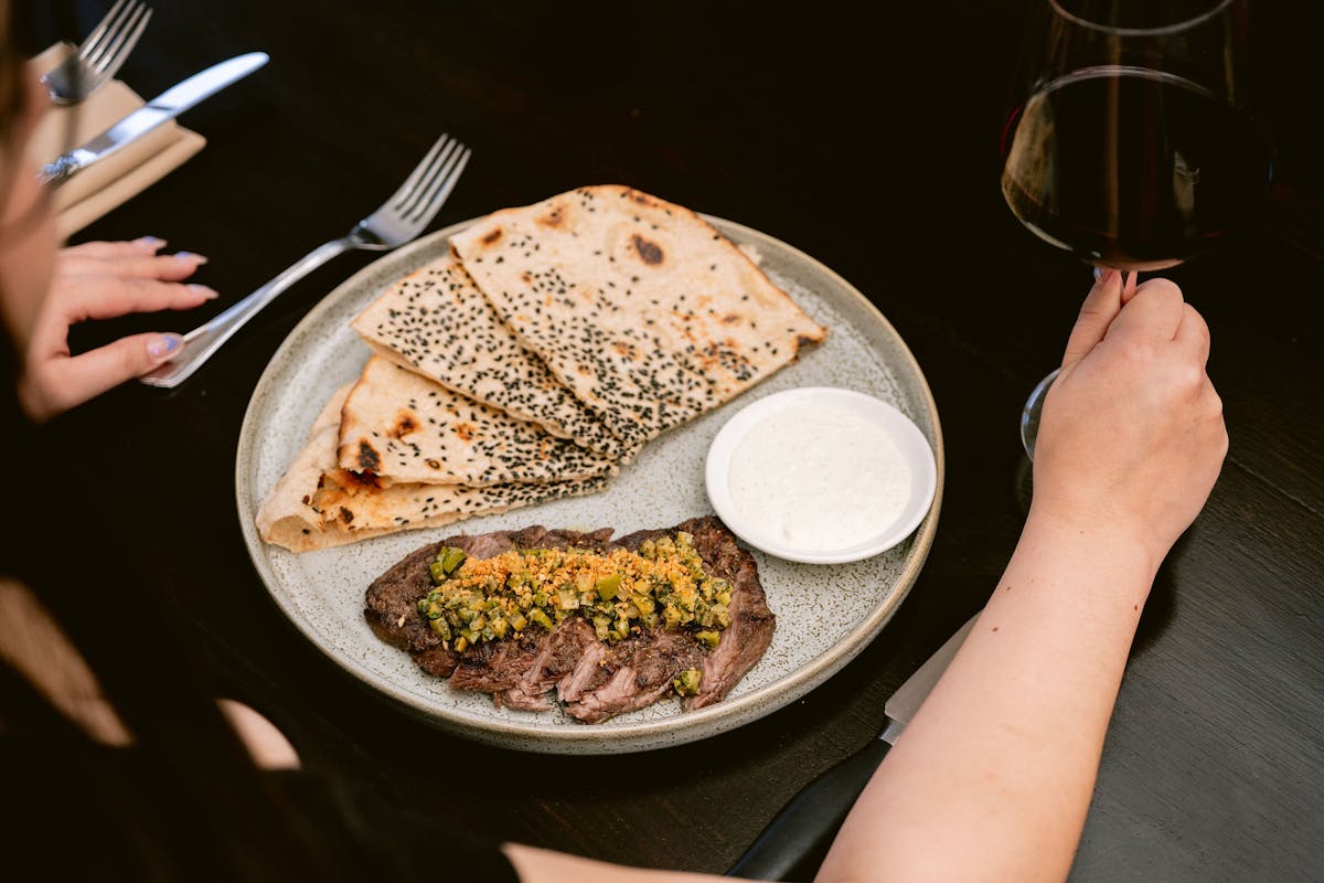 a woman holding a plate of food