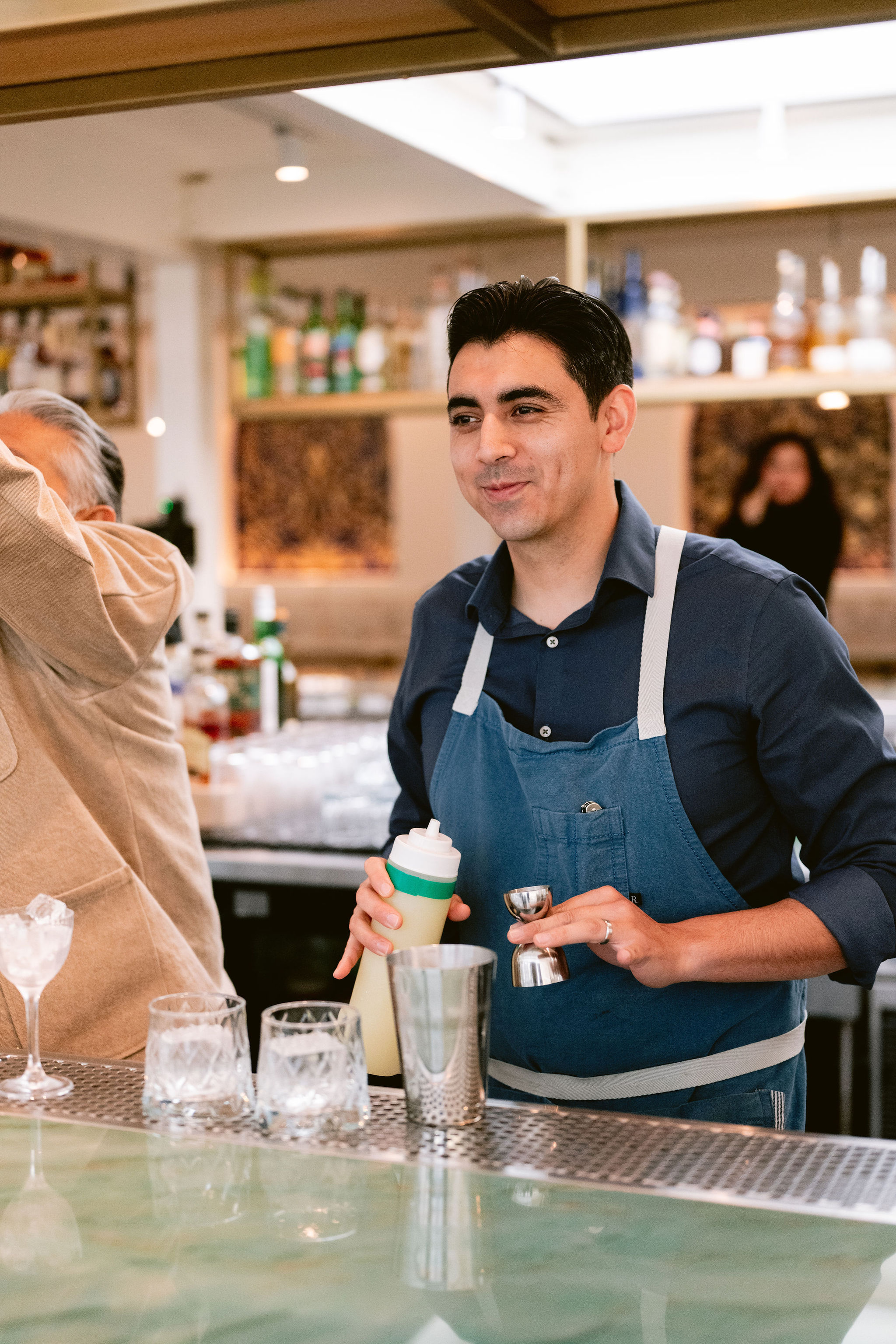 a man and a woman standing in front of a cake