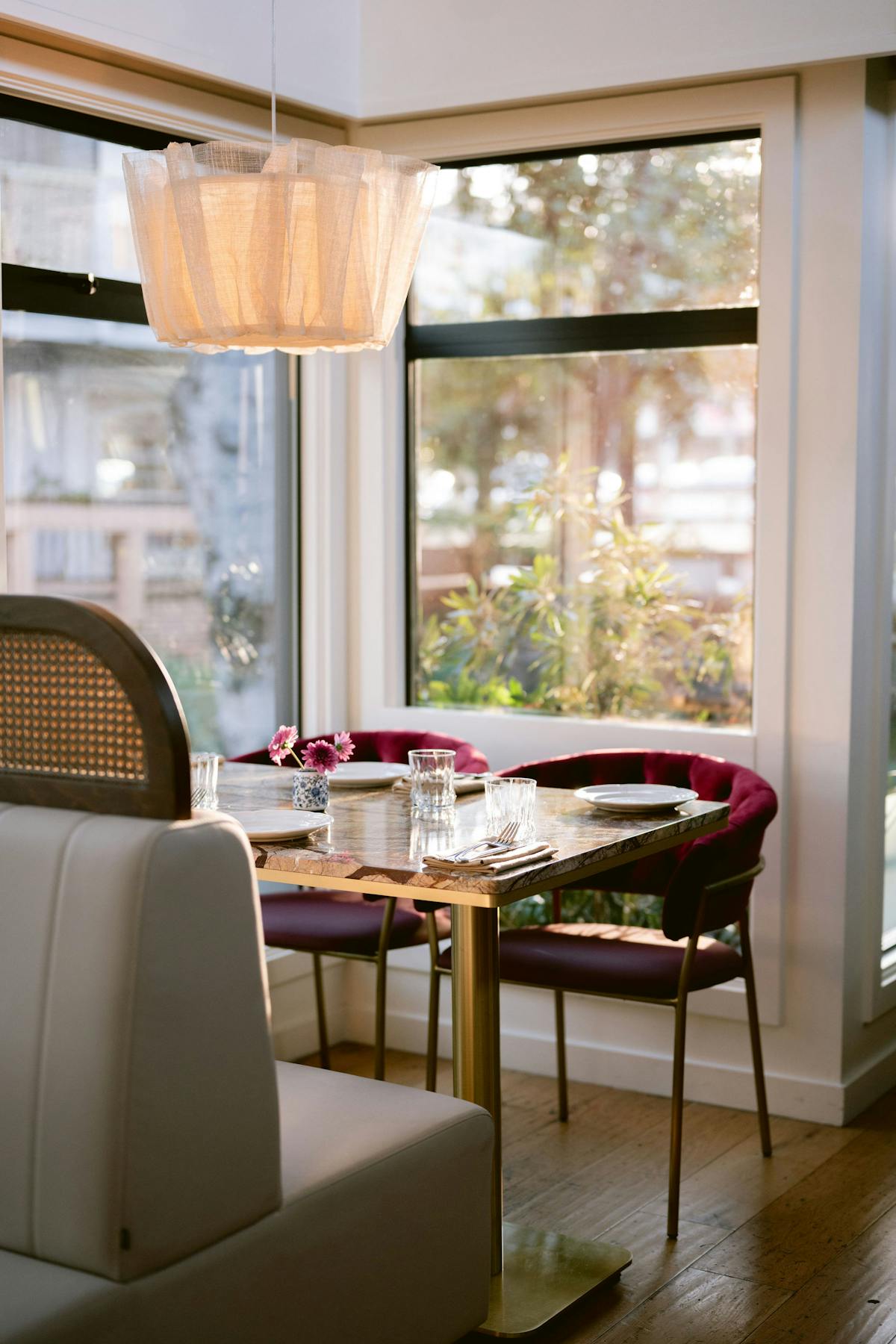 a dining room table in front of a window