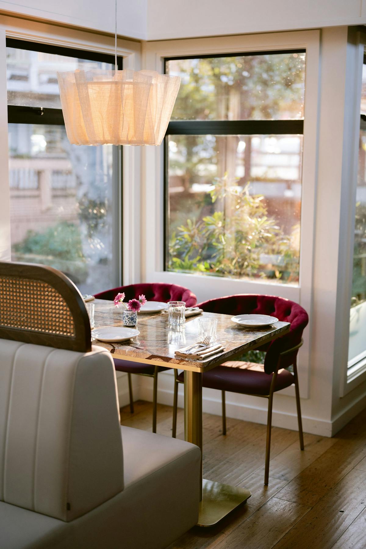 a dining room table in front of a window