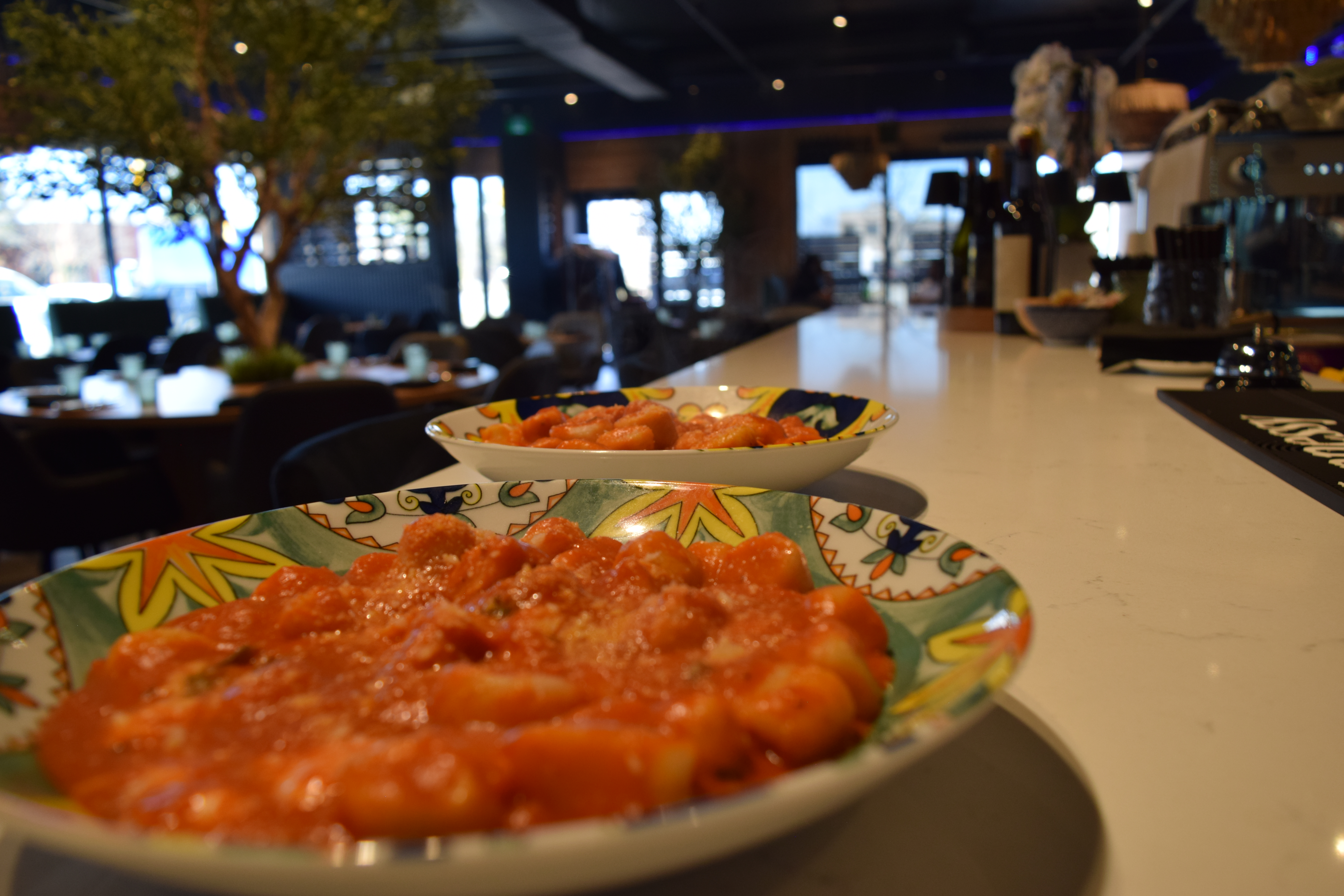 a plate of gnocchi sitting on bar