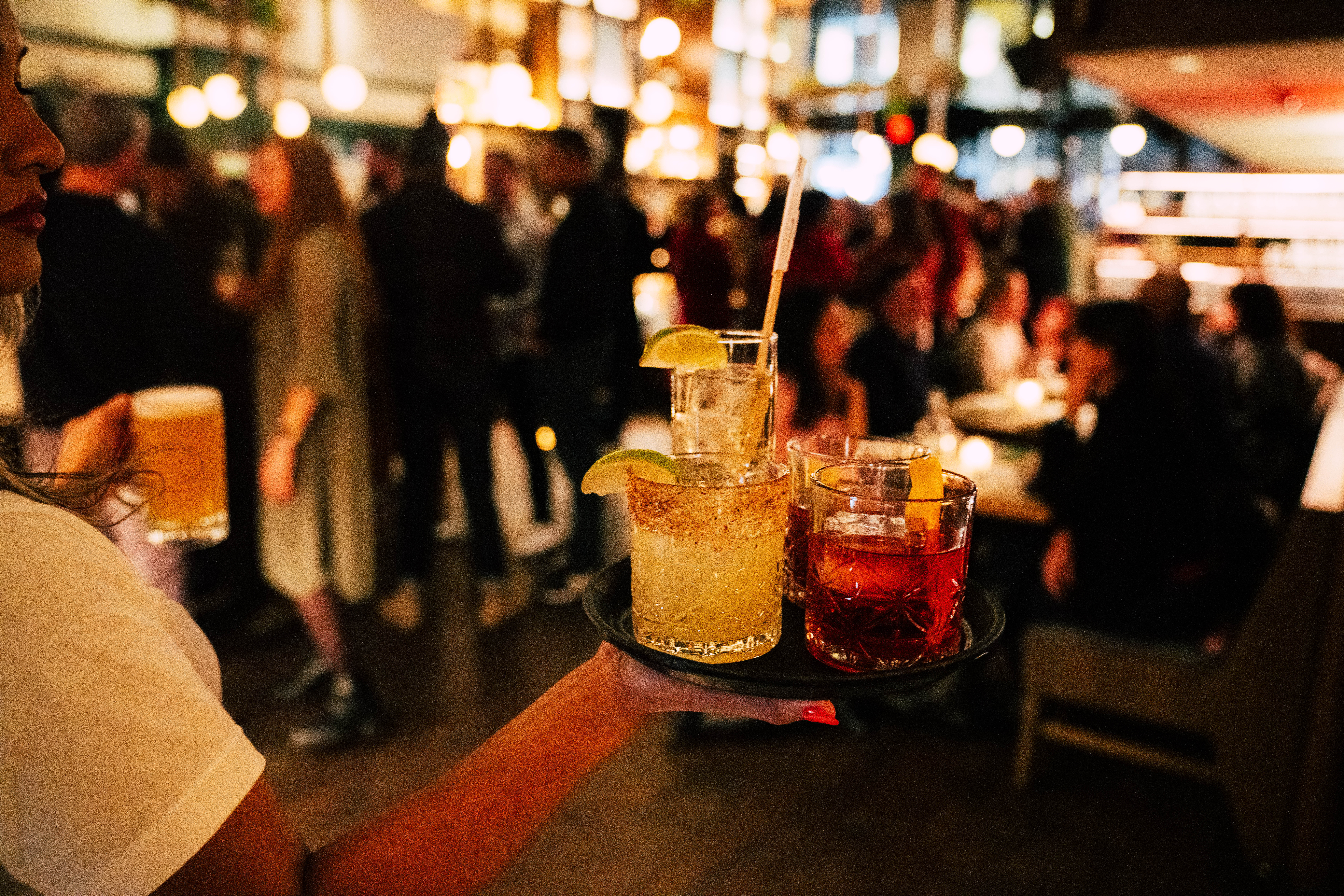 a group of people sitting at a table with wine glasses
