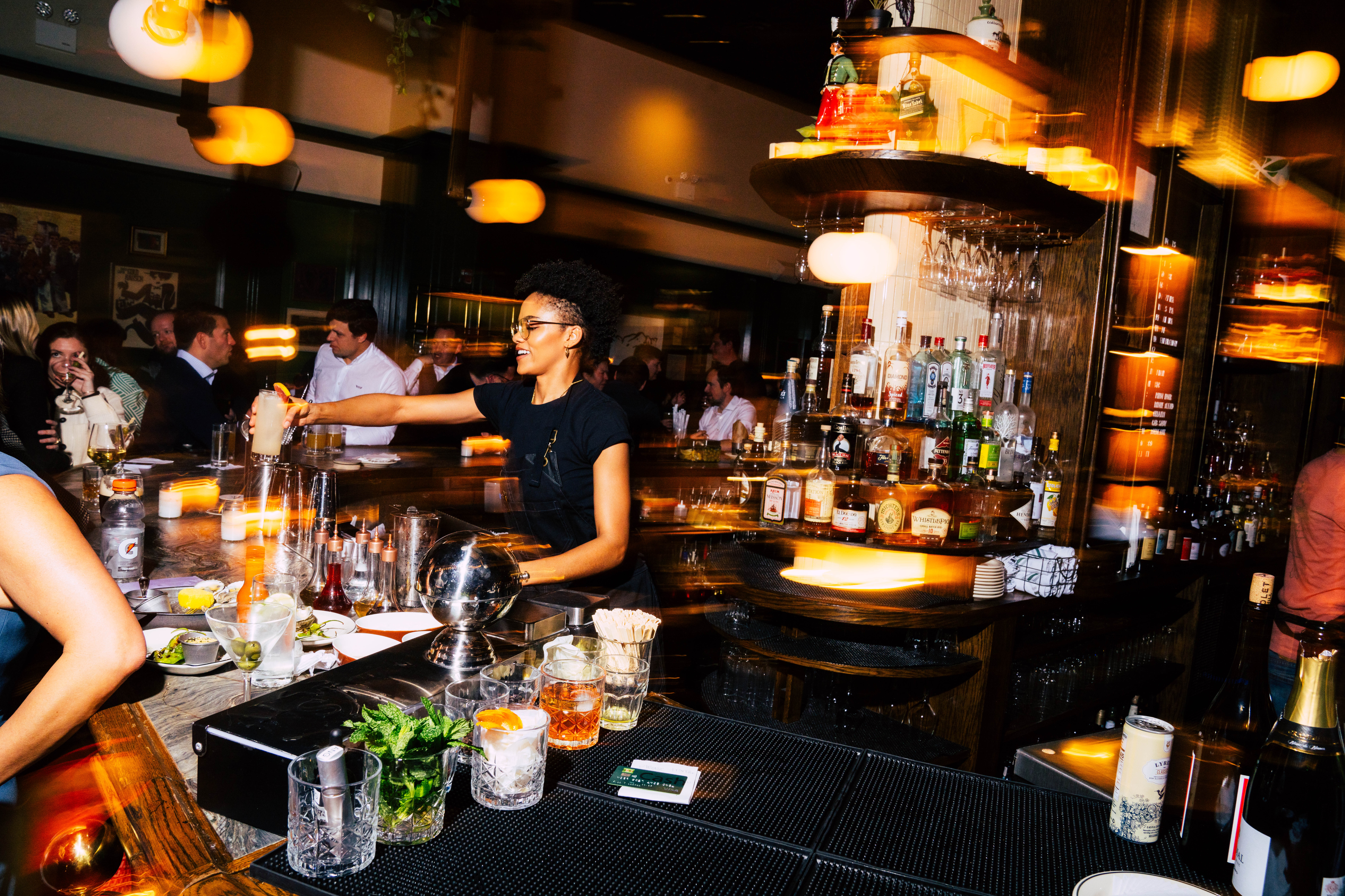 a woman preparing food in a restaurant