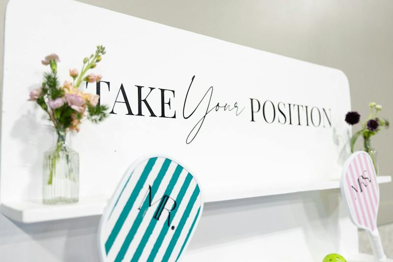 Take Your Position paddle wall wedding backdrop at Dink & Dine Pickle Park