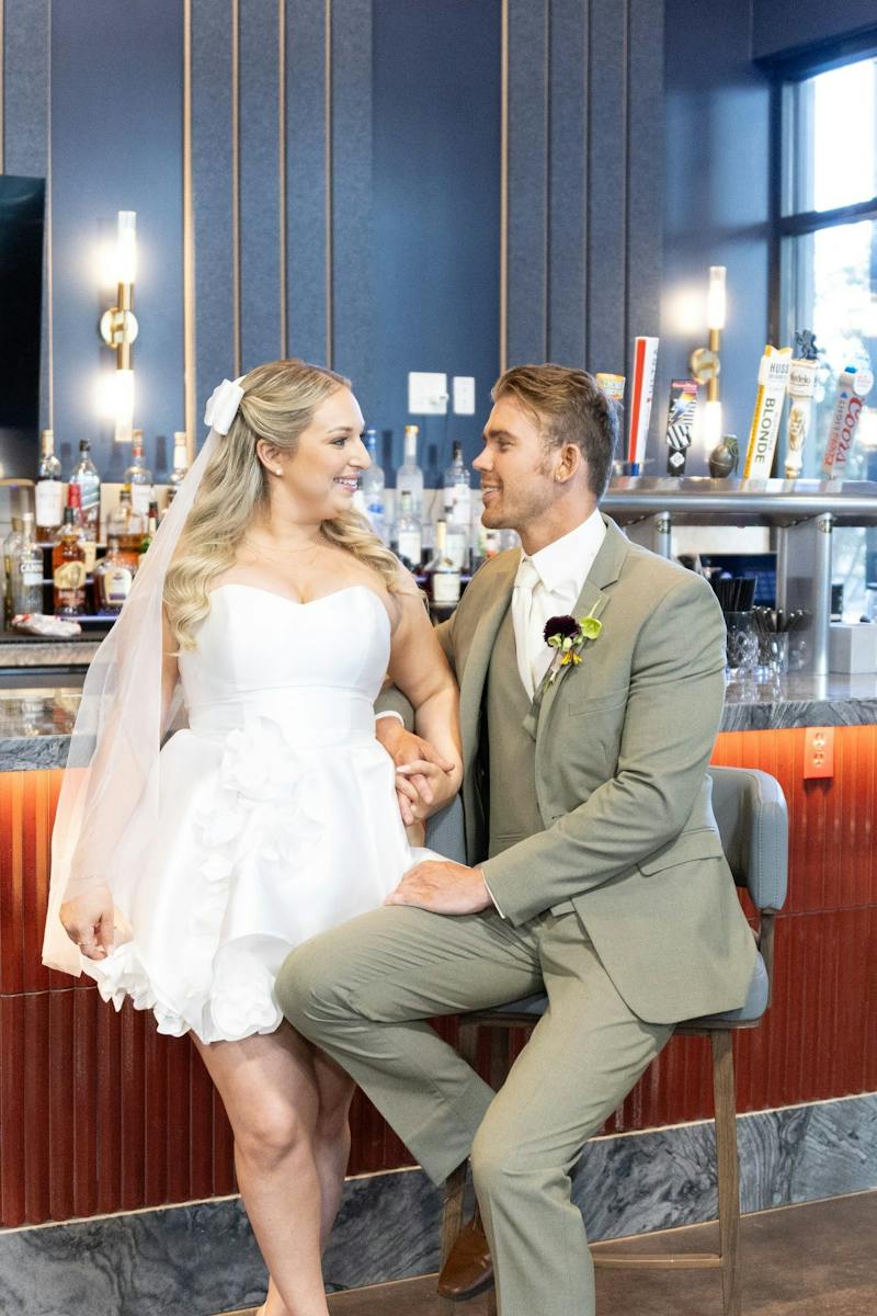 Bride and groom at the bar at Dink & Dine Pickle Park