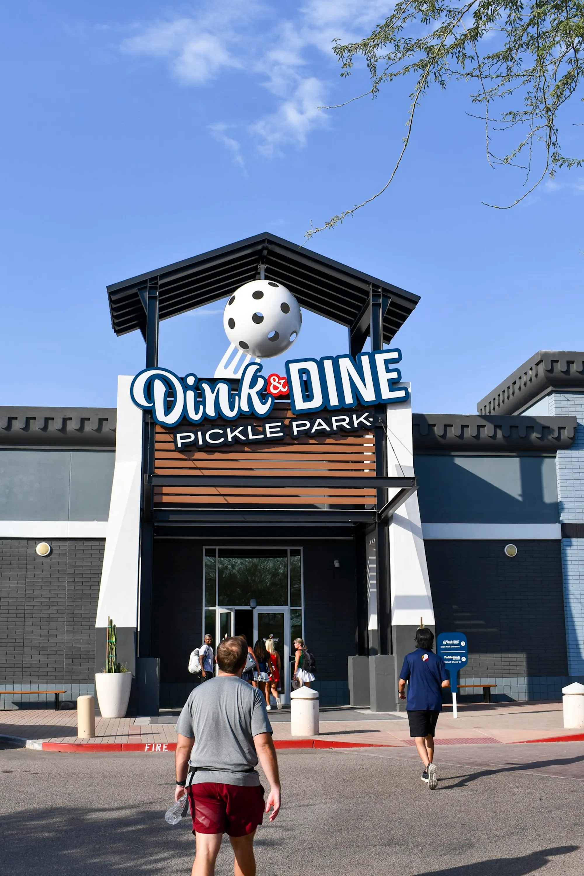 The Dink & Dine Pickle Park entrance sign welcoming guests