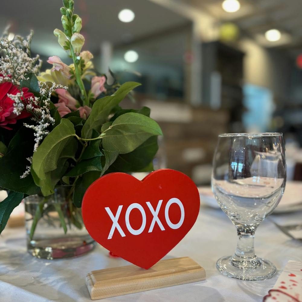 a glass of wine sitting on top of a table