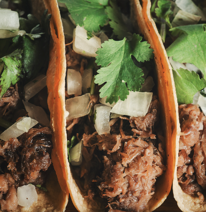 a sandwich filled with meat and vegetables