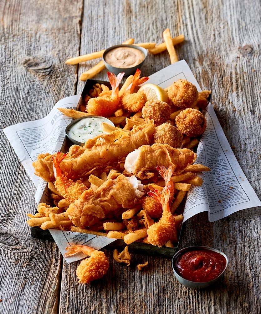 a sandwich sitting on top of a wooden table
