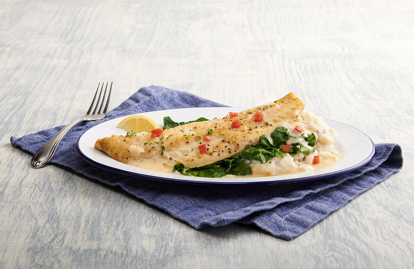 a cut in half sandwich sitting on top of a table