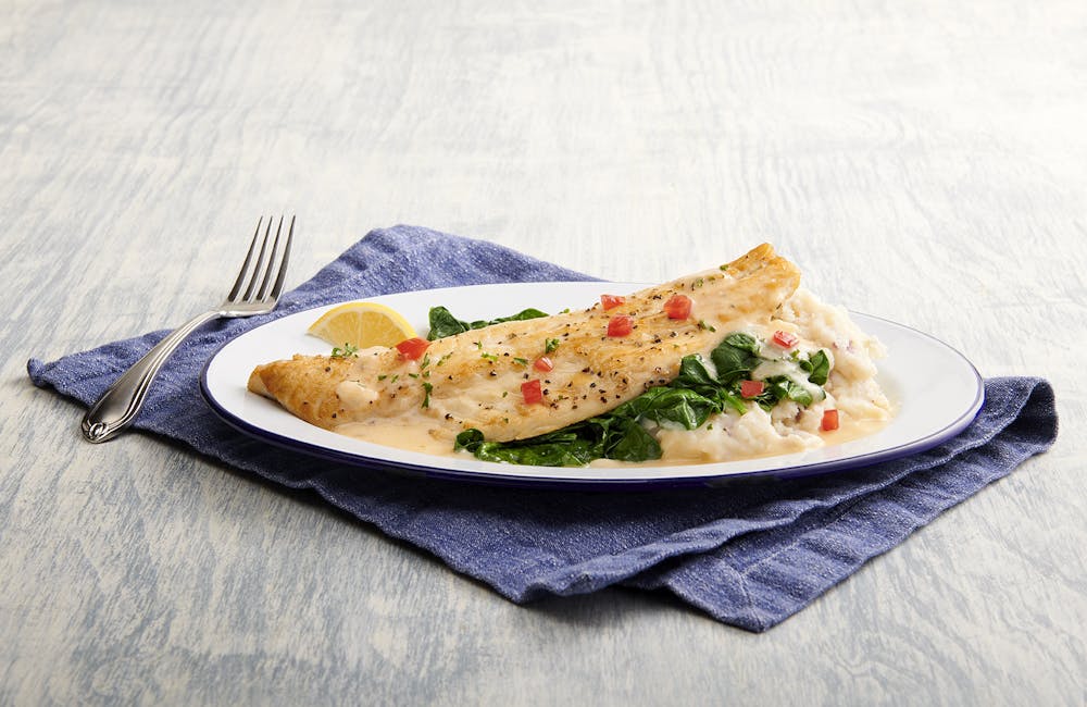 a cut in half sandwich sitting on top of a table