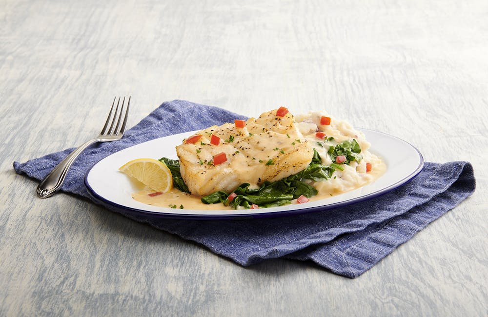 a cut in half sandwich sitting on top of a table