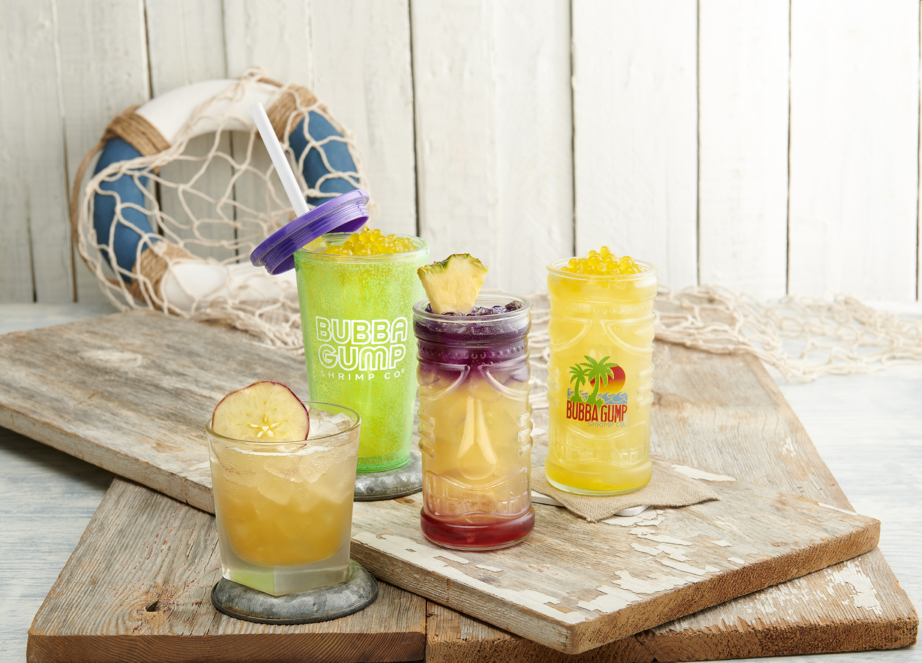 a glass of orange juice on a wooden table