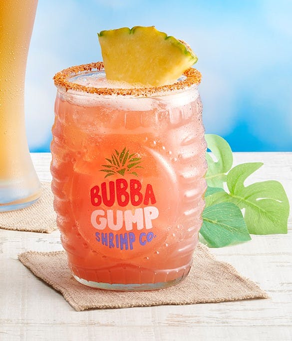 a glass of orange juice next to a cup of coffee