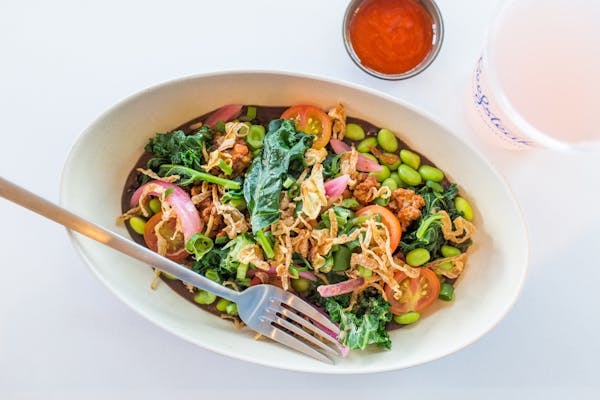 a bowl of salad on a plate