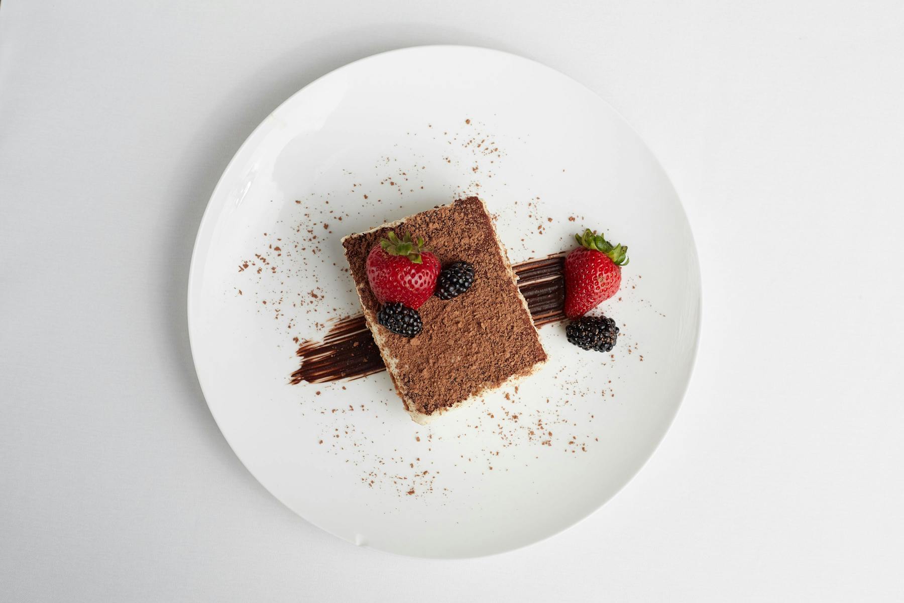a piece of cake sitting on top of a white plate