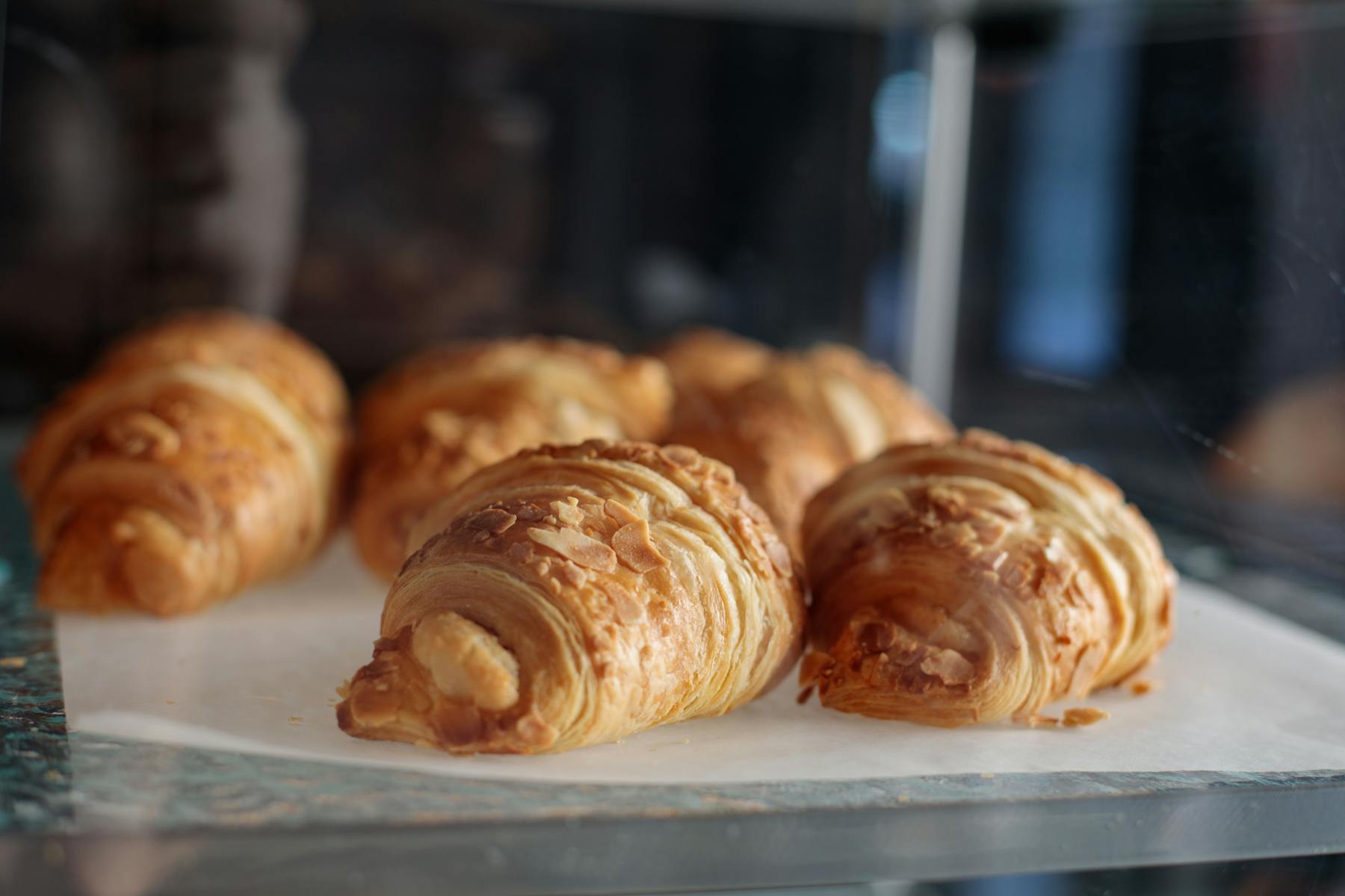croissant in a glass display case