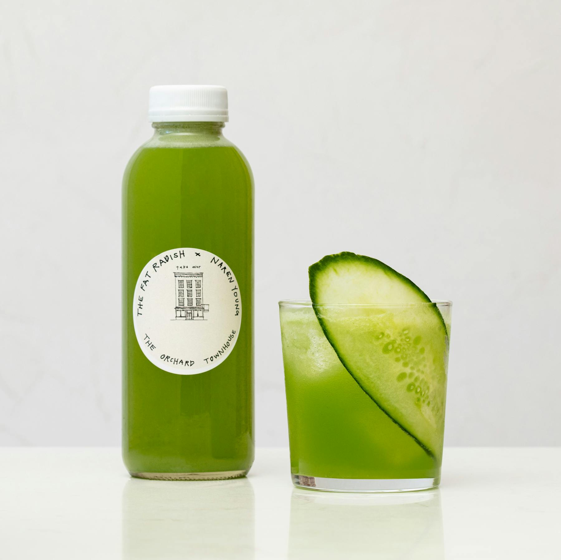 a green bottle on a table