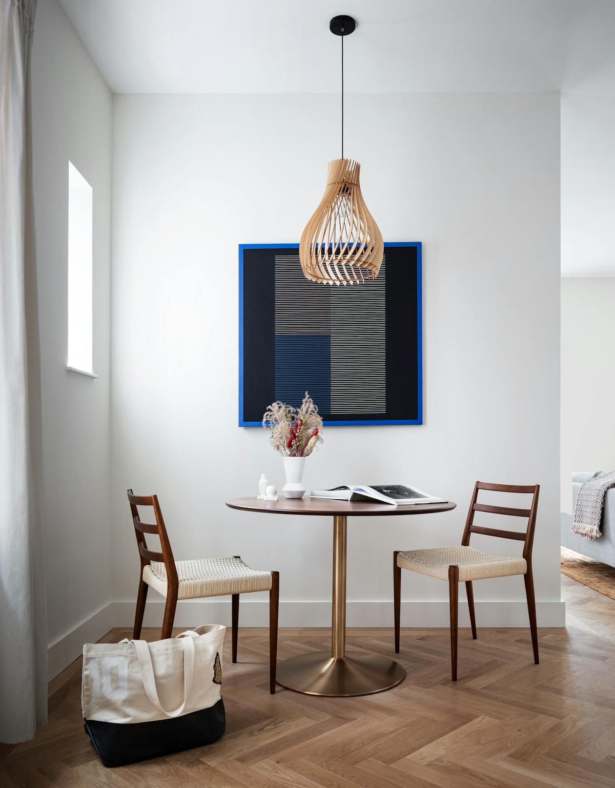 a living room filled with furniture and a mirror